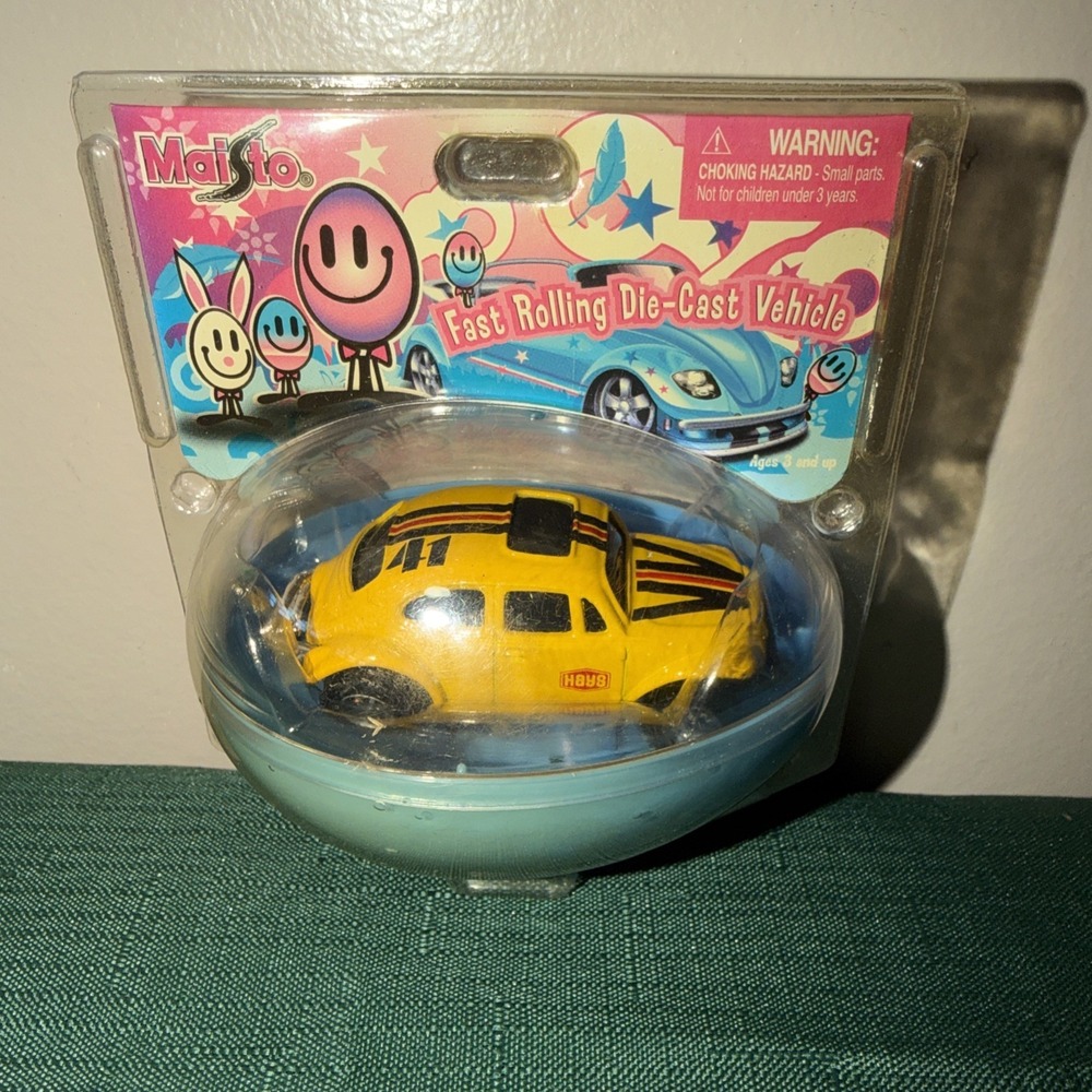 Marto Fast Rolling Die-Cast. a toy car modeled after a classic Volkswagen Beetle